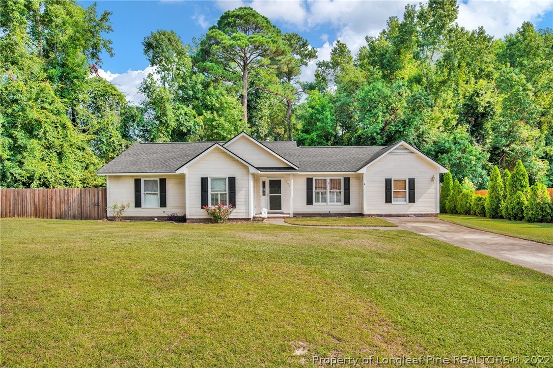203 Overton Road Raeford, NC 28376 - Photo 1 of 32 a front of a house with a garden