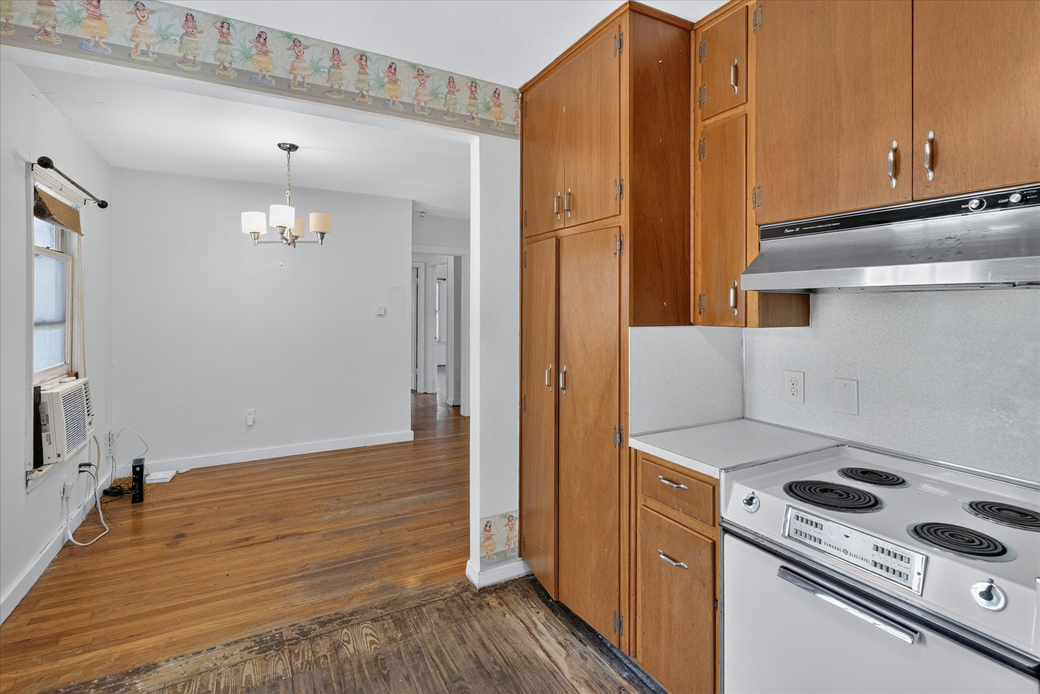 5701 Link Avenue Austin, TX 78752 - Photo 5 of 7 a kitchen with a stove and a refrigerator