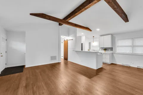 a view of kitchen with wooden floor