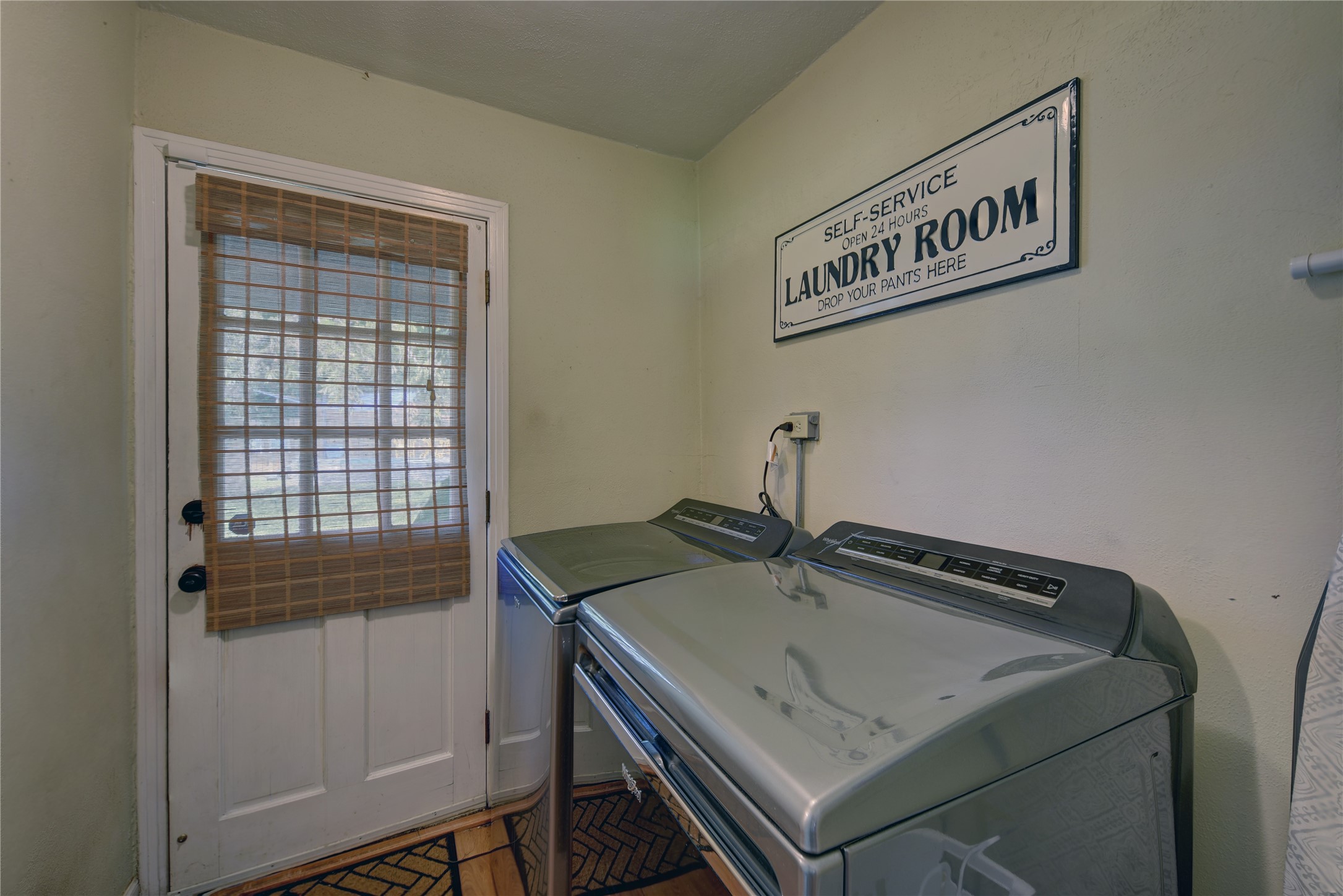 706 South Market Street Brenham, TX 77833 - Photo 13 of 27 a kitchen that has a sink and a stove in it