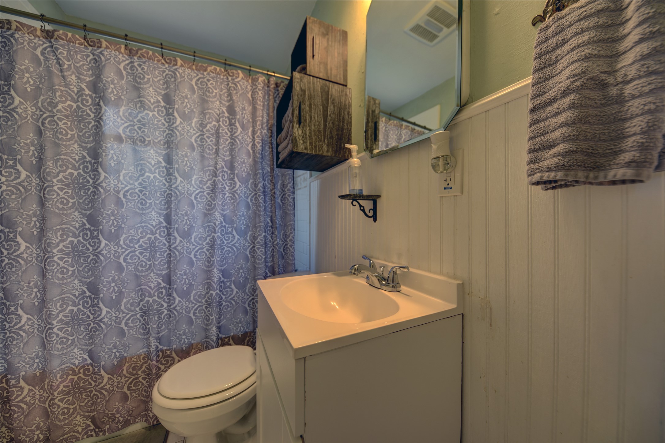706 South Market Street Brenham, TX 77833 - Photo 17 of 27 a bathroom with a toilet sink and shower