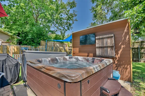 a view of a backyard with a tub