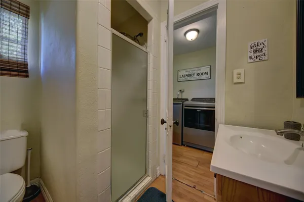 a view of a kitchen from the hallway