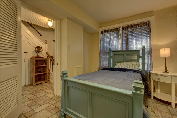 a bedroom with a bed and furniture