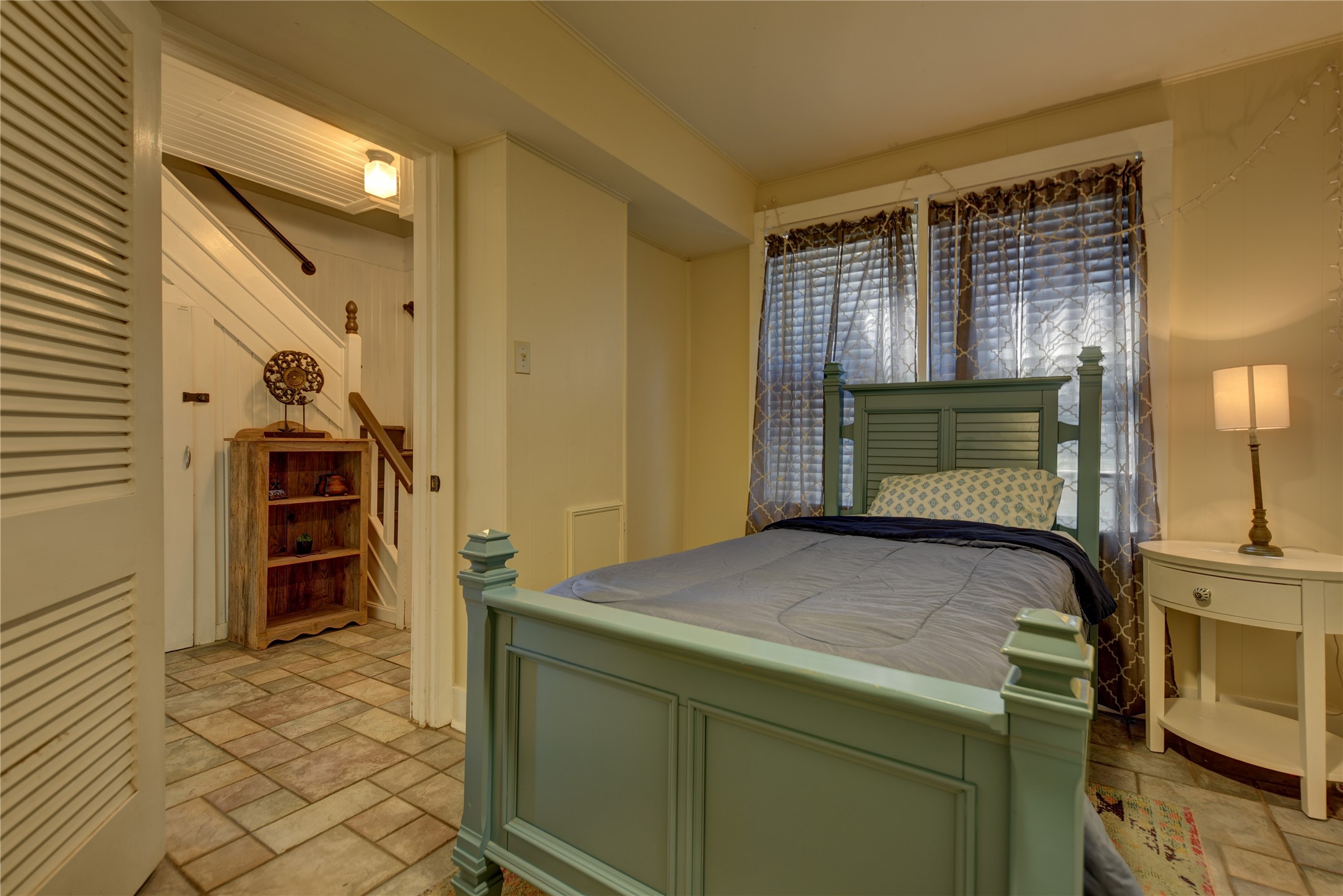 706 South Market Street Brenham, TX 77833 - Photo 8 of 27 a bedroom with a bed and furniture