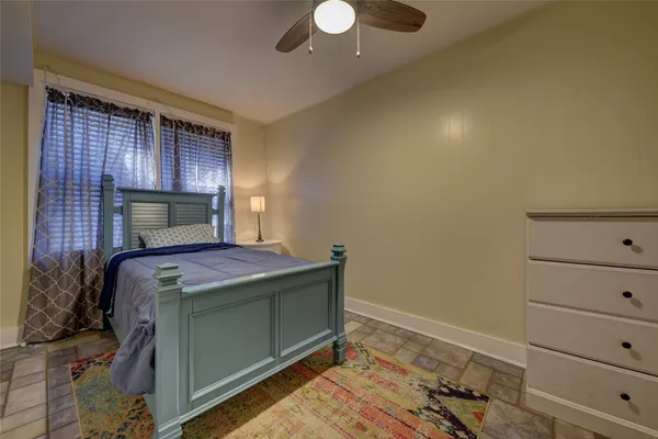 a room with a bed and lamp