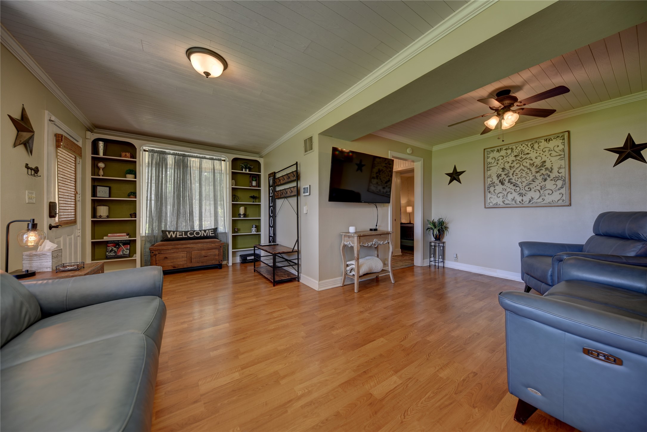 706 South Market Street Brenham, TX 77833 - Photo 10 of 27 a living room with furniture and a flat screen tv