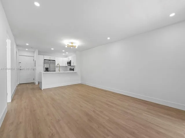 a view of kitchen with wooden floor