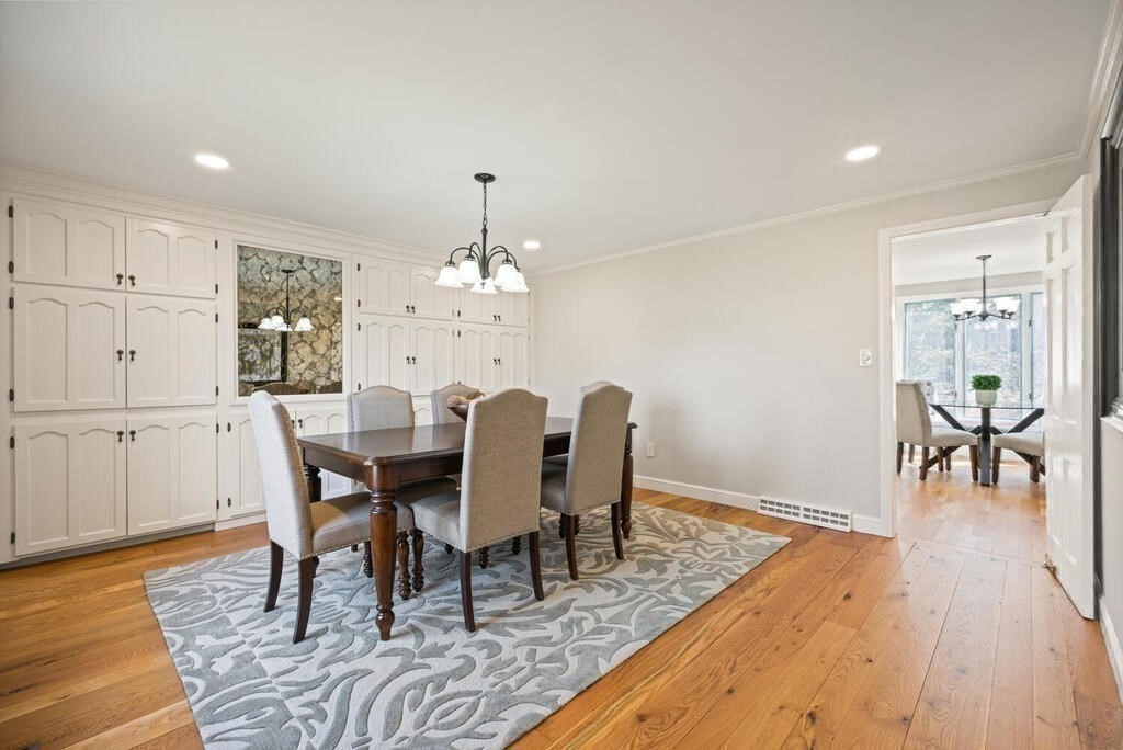 18 Philip Road Lexington, MA 02421 - Photo 13 of 38 a view of a dining room with furniture and wooden floor