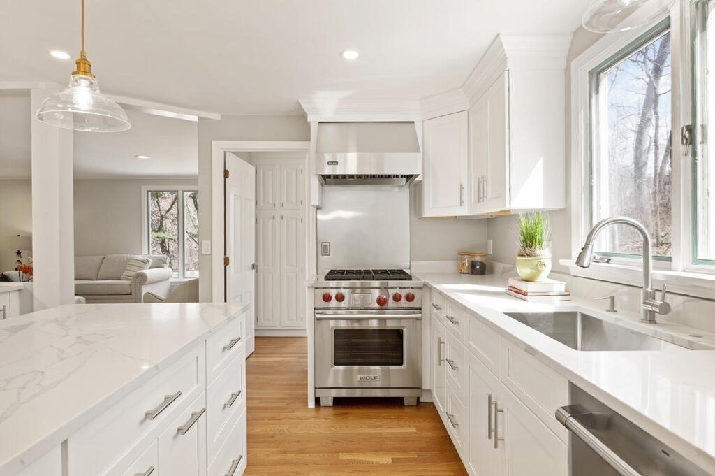 18 Philip Road Lexington, MA 02421 - Photo 15 of 38 a kitchen with a sink stove and cabinets
