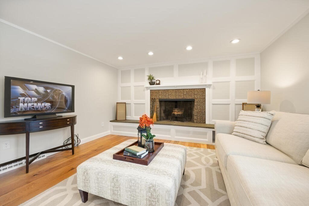 18 Philip Road Lexington, MA 02421 - Photo 22 of 38 a living room with furniture and a flat screen tv