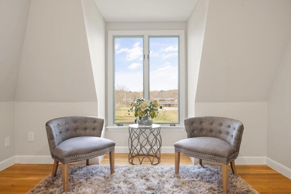 18 Philip Road Lexington, MA 02421 - Photo 26 of 38 a living room with furniture and a large window