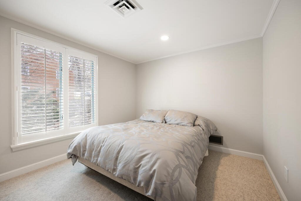 18 Philip Road Lexington, MA 02421 - Photo 29 of 38 a bed sitting in a bedroom next to a window