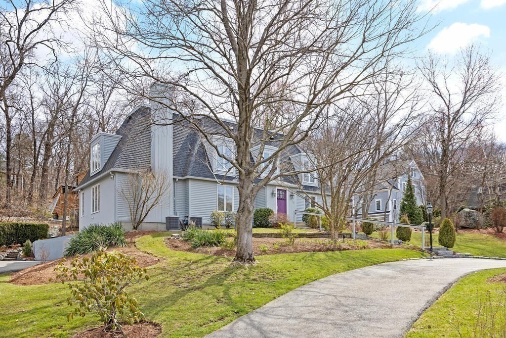 18 Philip Road Lexington, MA 02421 - Photo 3 of 38 a view of a house with a yard covered in snow