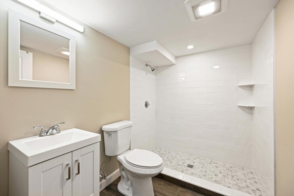 18 Philip Road Lexington, MA 02421 - Photo 34 of 38 a bathroom with a sink toilet and shower