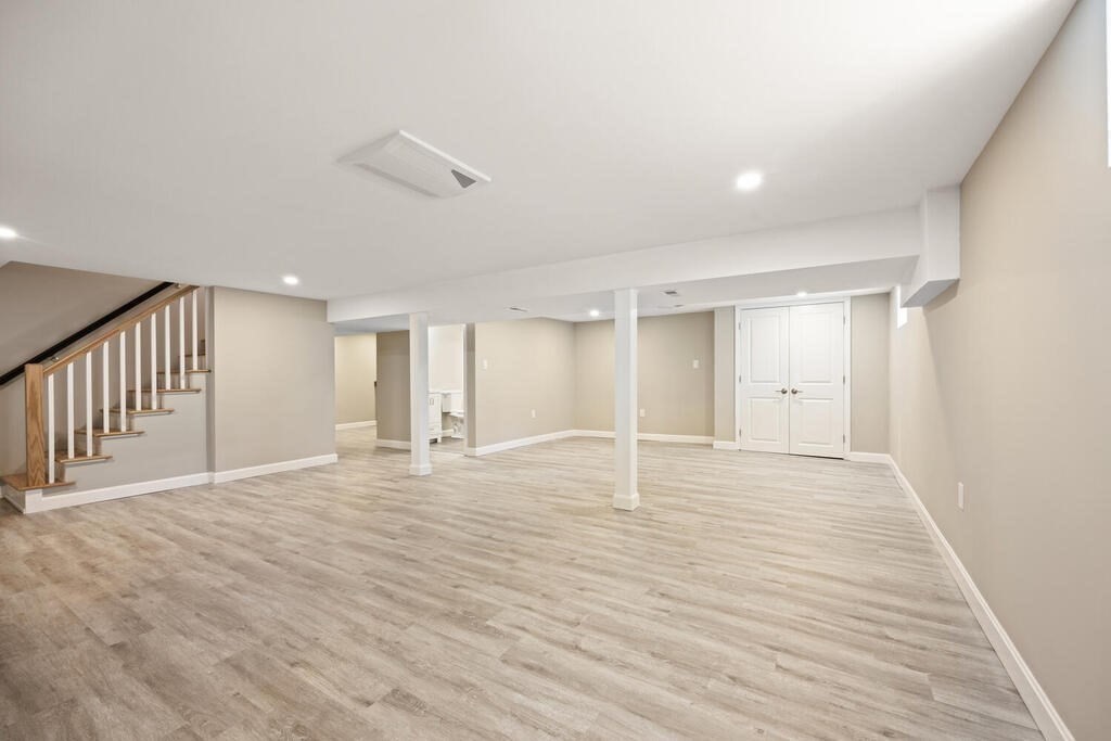 18 Philip Road Lexington, MA 02421 - Photo 35 of 38 a view of an empty room with wooden floor and windows