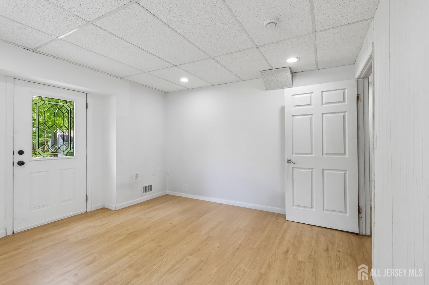 36 Henry Street Edison, NJ 08820 - Photo 24 of 42 a view of empty room with wooden floor