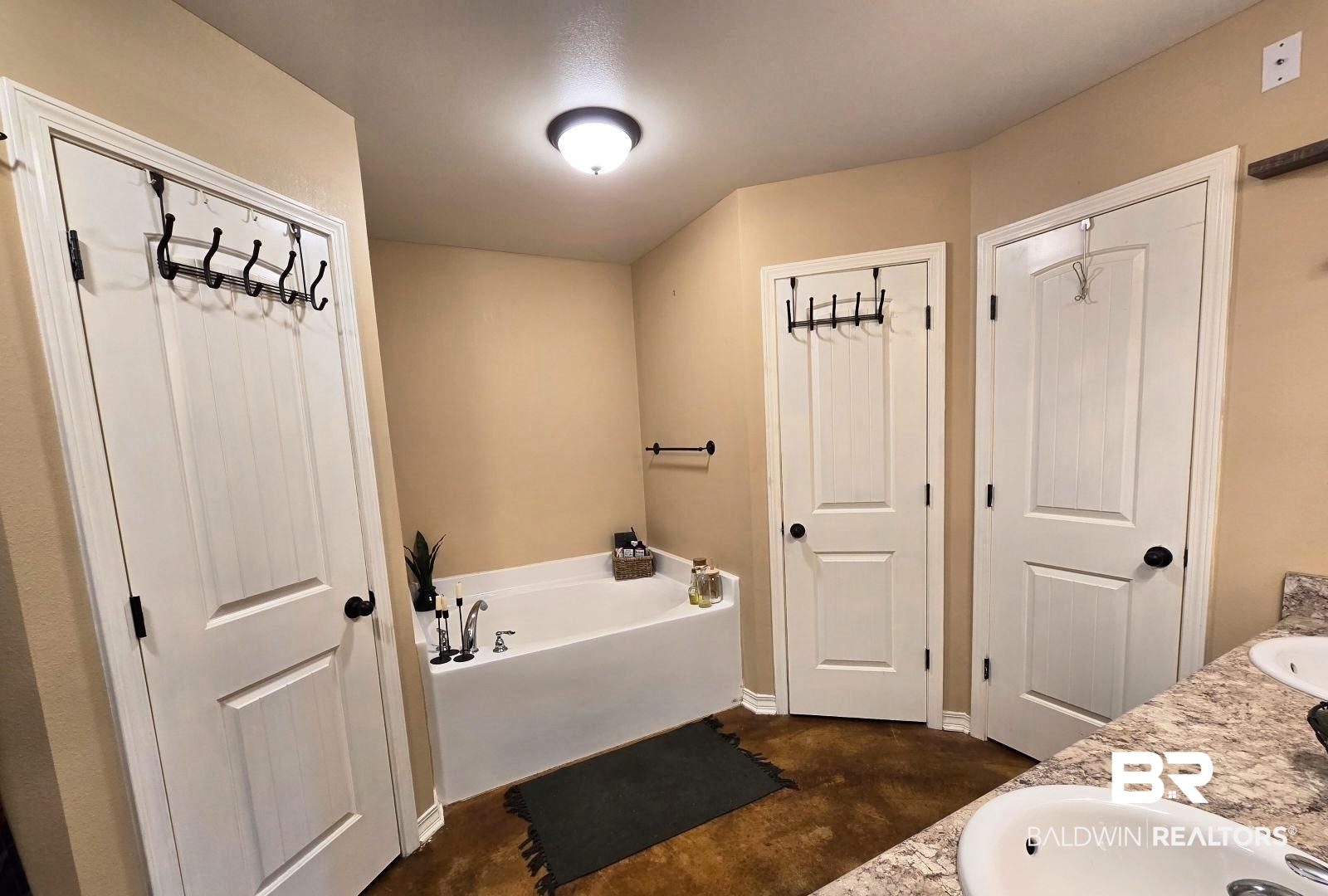 52041 Robert White Road Bay Minette, AL 36507 - Photo 15 of 16 Bathroom with a bath, concrete floors, and vanity