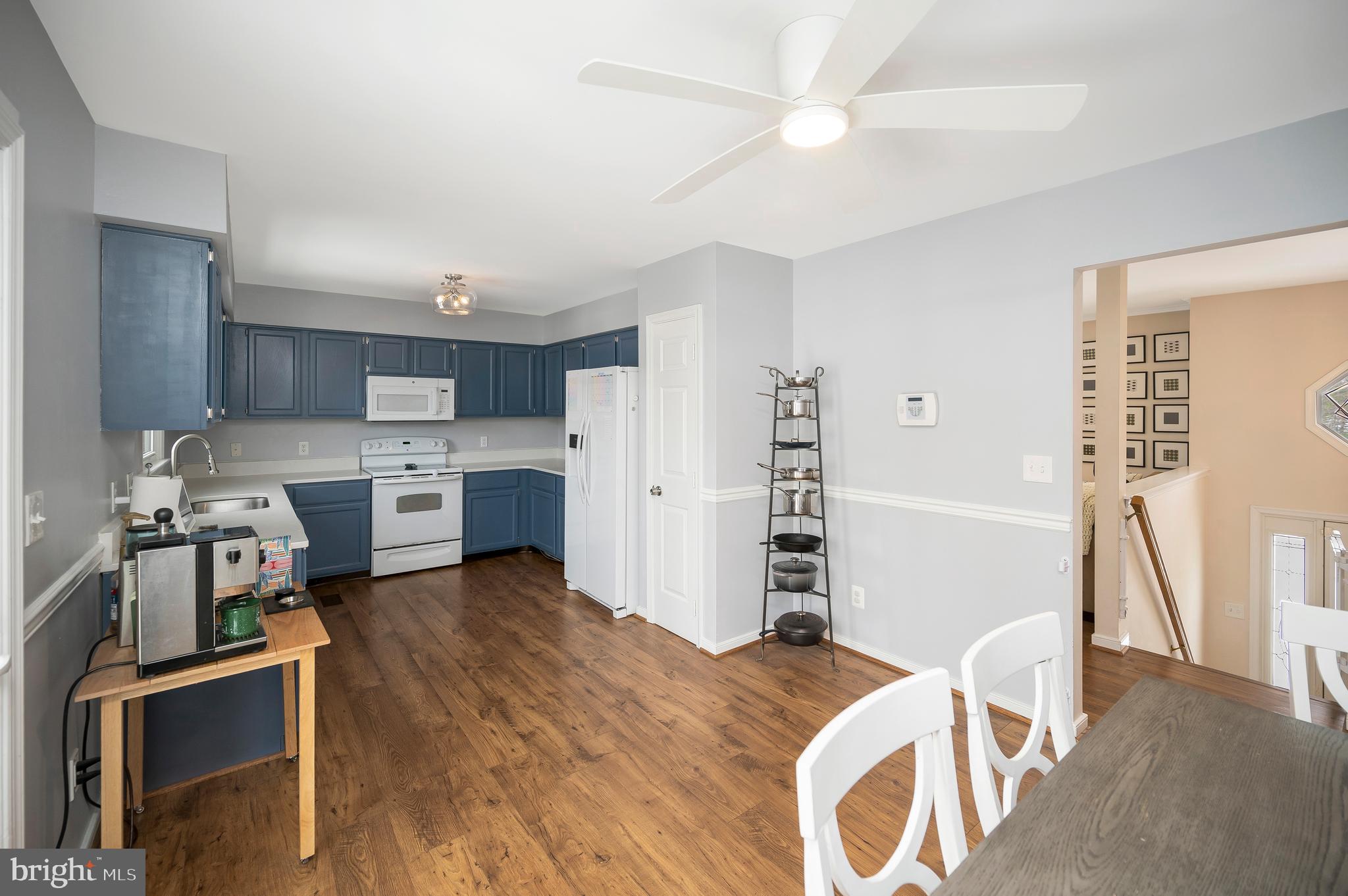 228 Choptank Road Stafford, VA 22556 - Photo 14 of 56 a kitchen with stainless steel appliances a stove a refrigerator and a refrigerator