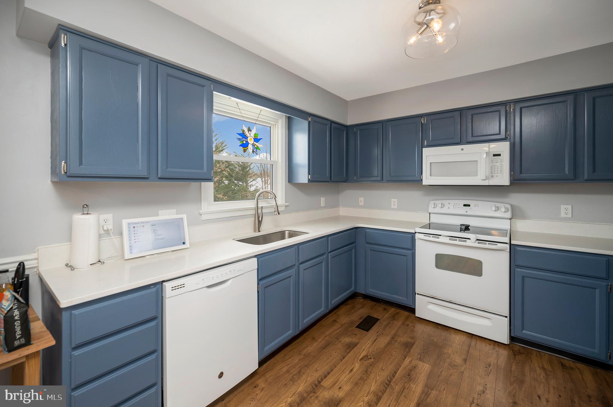 228 Choptank Road Stafford, VA 22556 - Photo 16 of 56 a kitchen with a sink cabinets and wooden floor