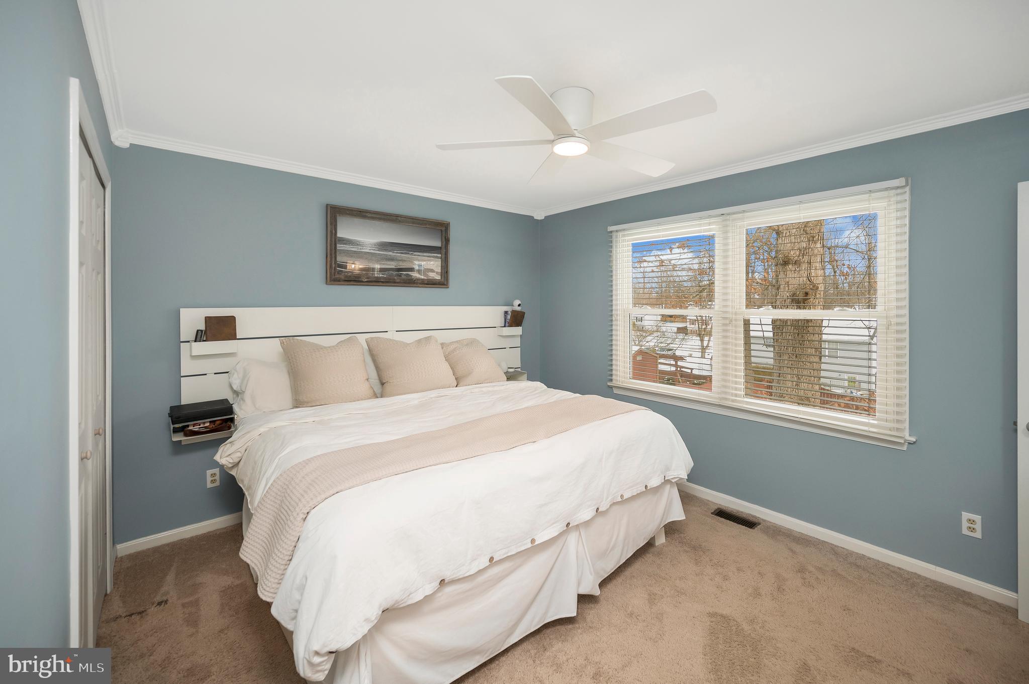 228 Choptank Road Stafford, VA 22556 - Photo 31 of 56 a large bed sitting in a bedroom next to a window