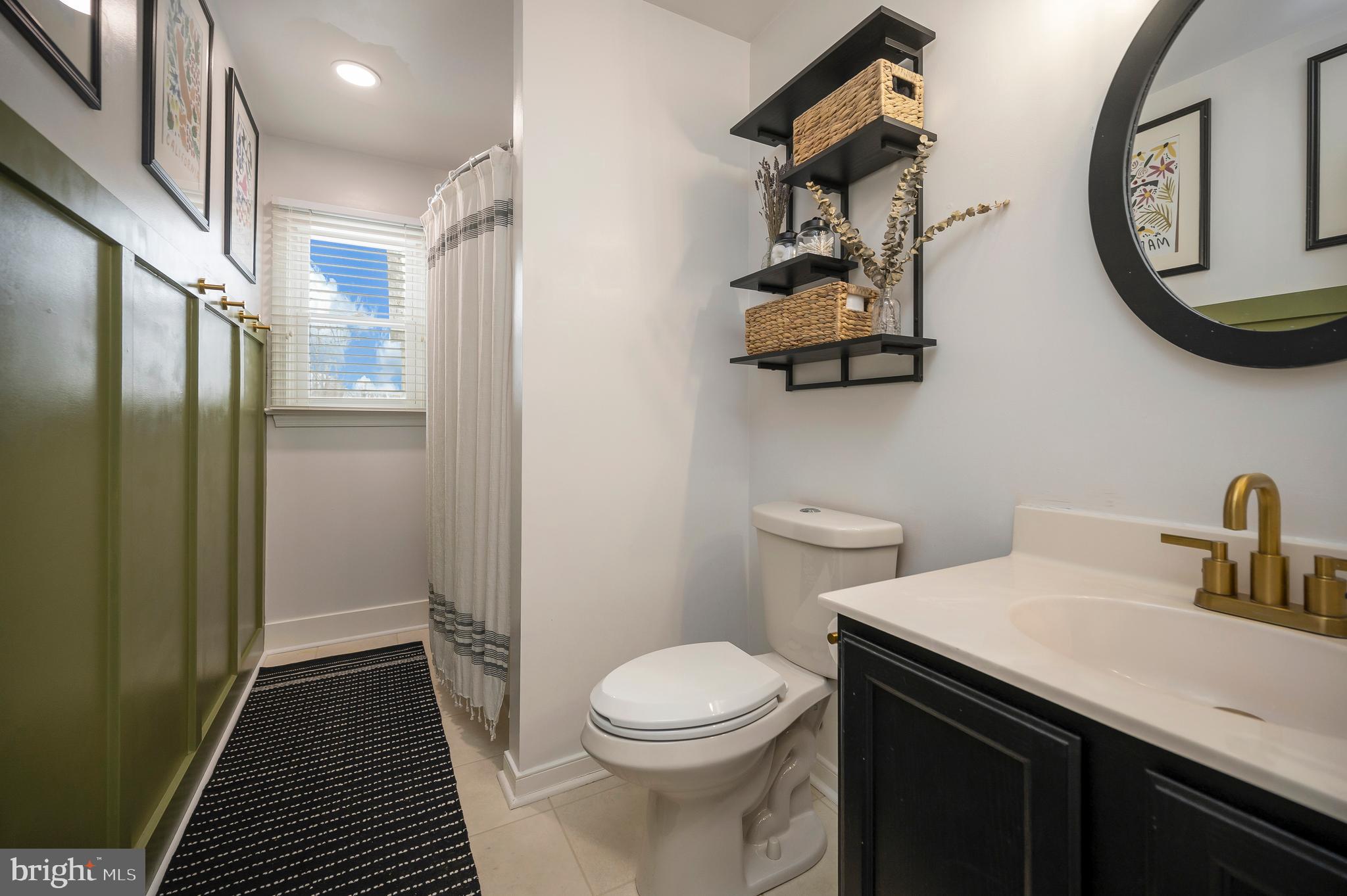 228 Choptank Road Stafford, VA 22556 - Photo 37 of 56 a bathroom with a toilet a sink and a mirror