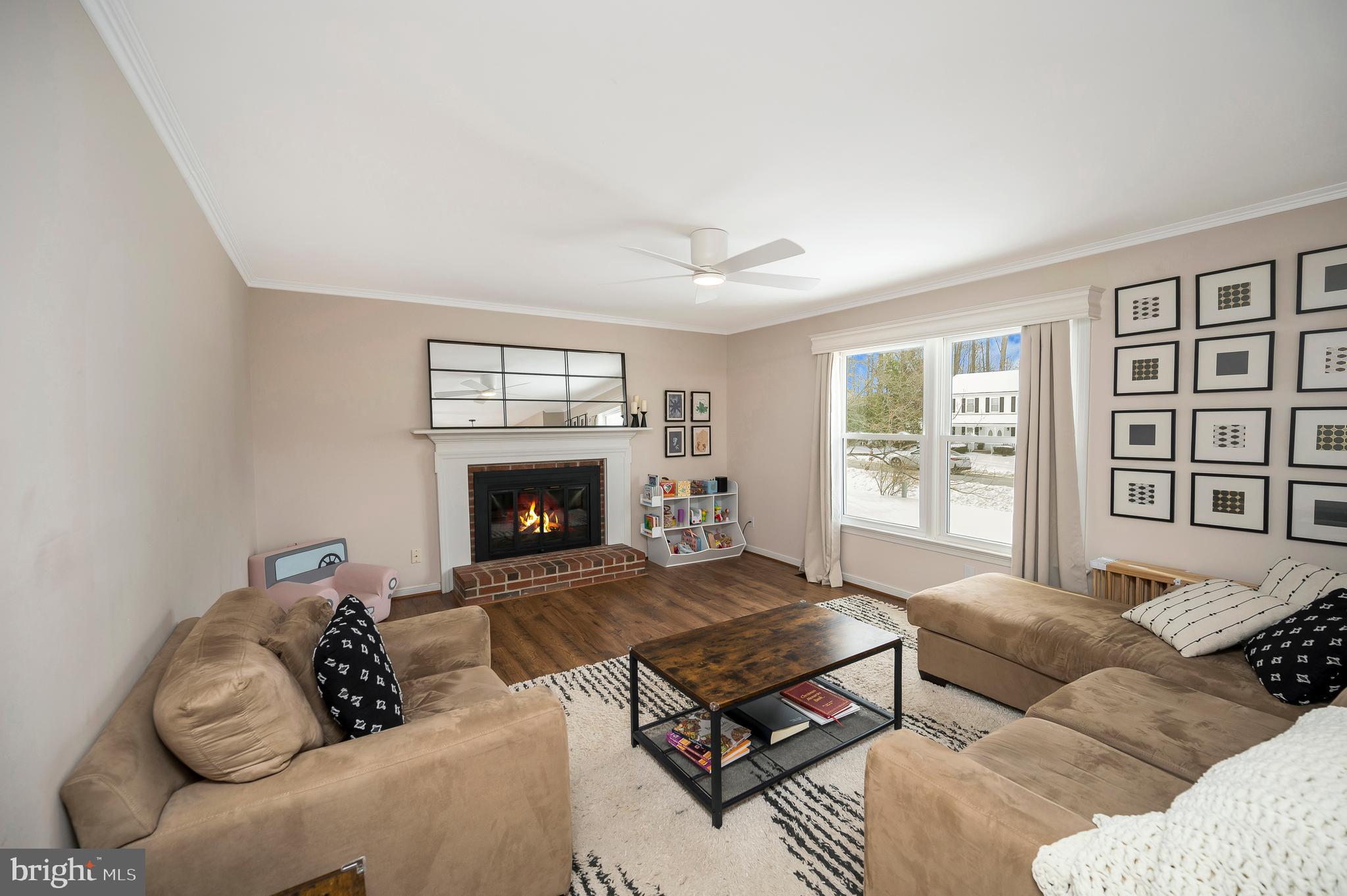 228 Choptank Road Stafford, VA 22556 - Photo 4 of 56 a living room with furniture and a fireplace