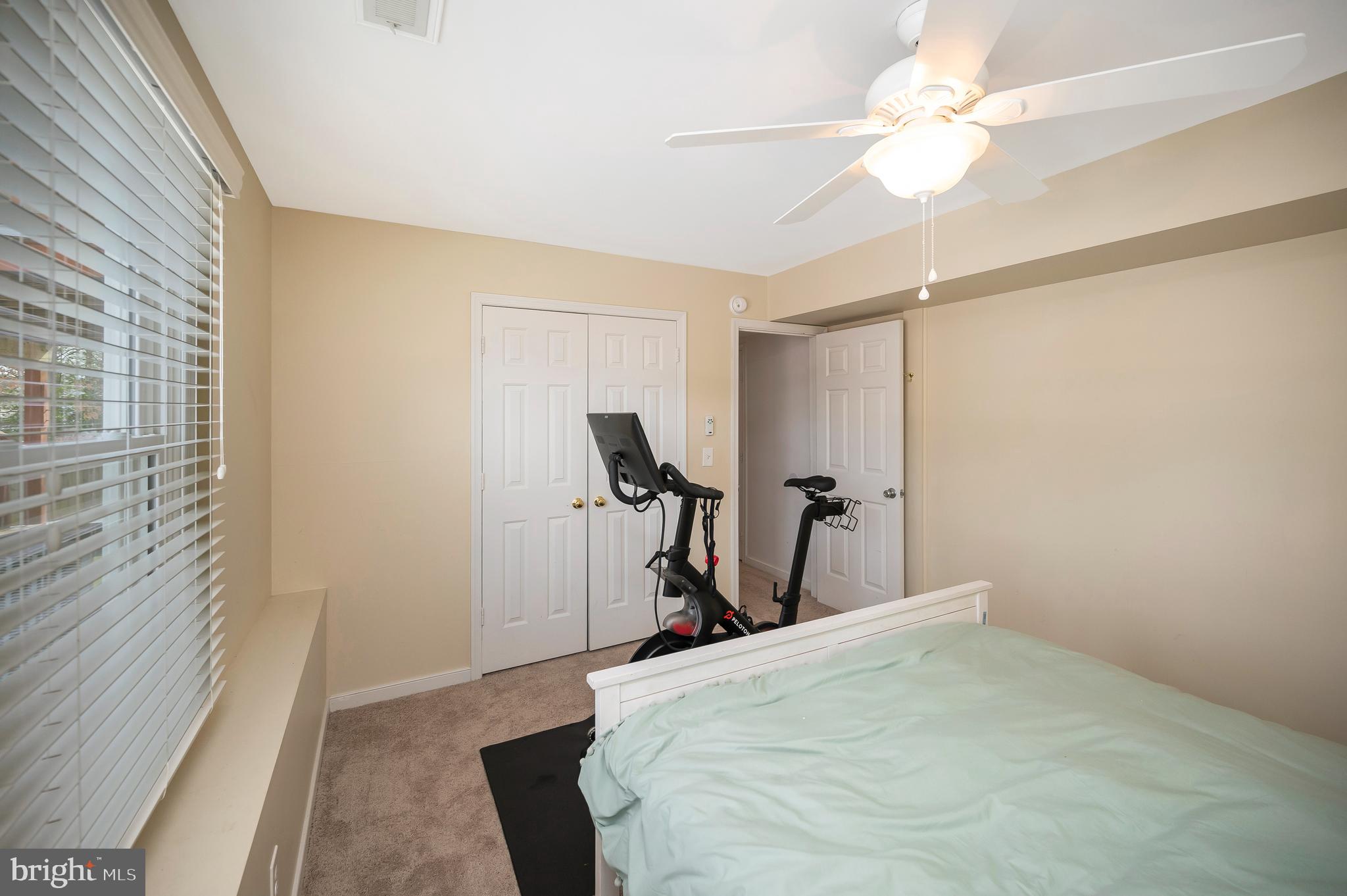 228 Choptank Road Stafford, VA 22556 - Photo 42 of 56 a bedroom with a bed and a chandelier