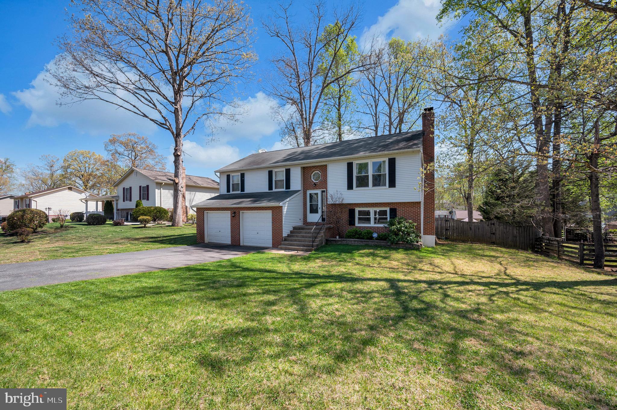 228 Choptank Road Stafford, VA 22556 - Photo 47 of 56 a view of a house with pool and trees in the background