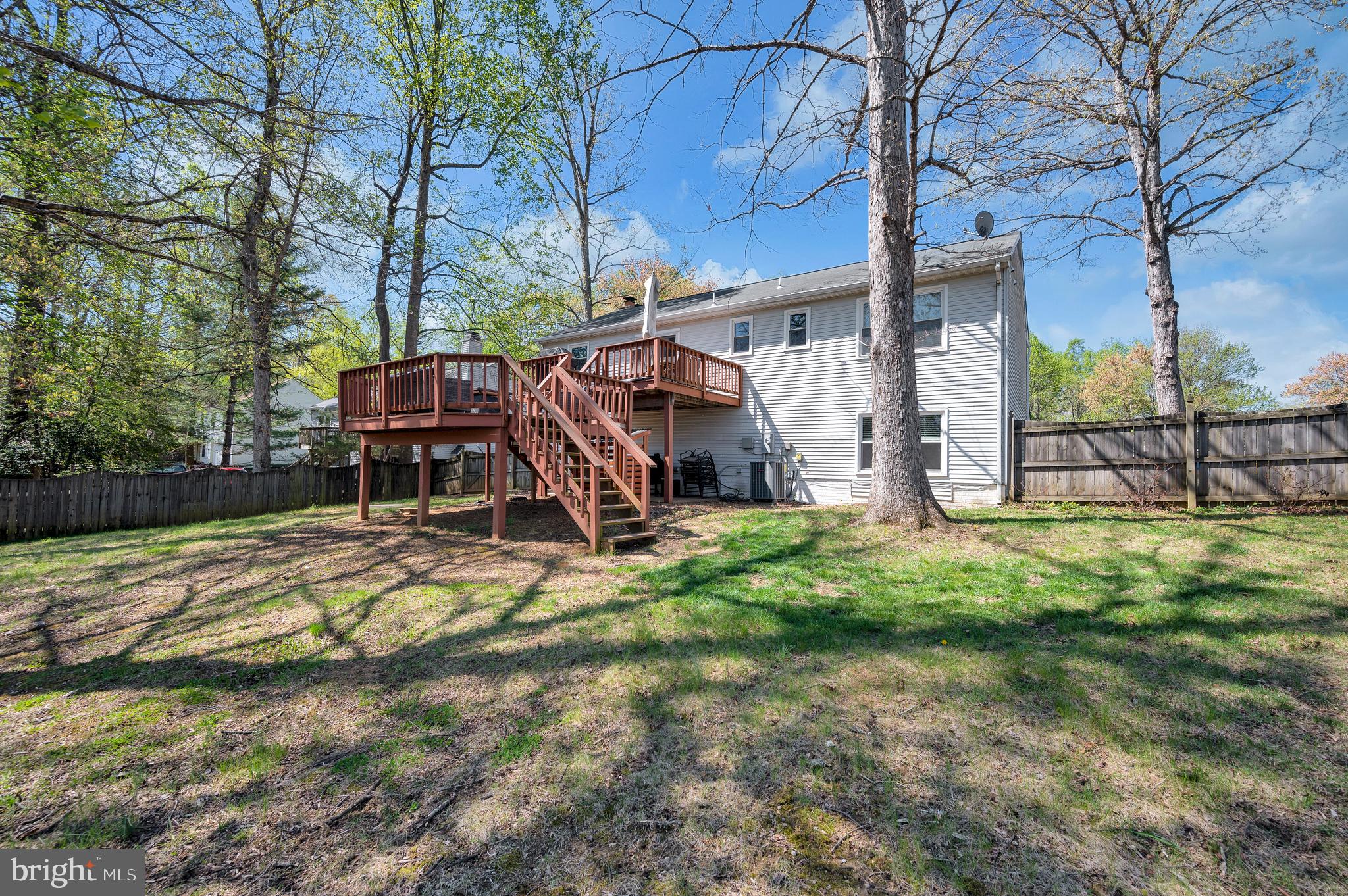 228 Choptank Road Stafford, VA 22556 - Photo 52 of 56 a view of a backyard with a wooden fence