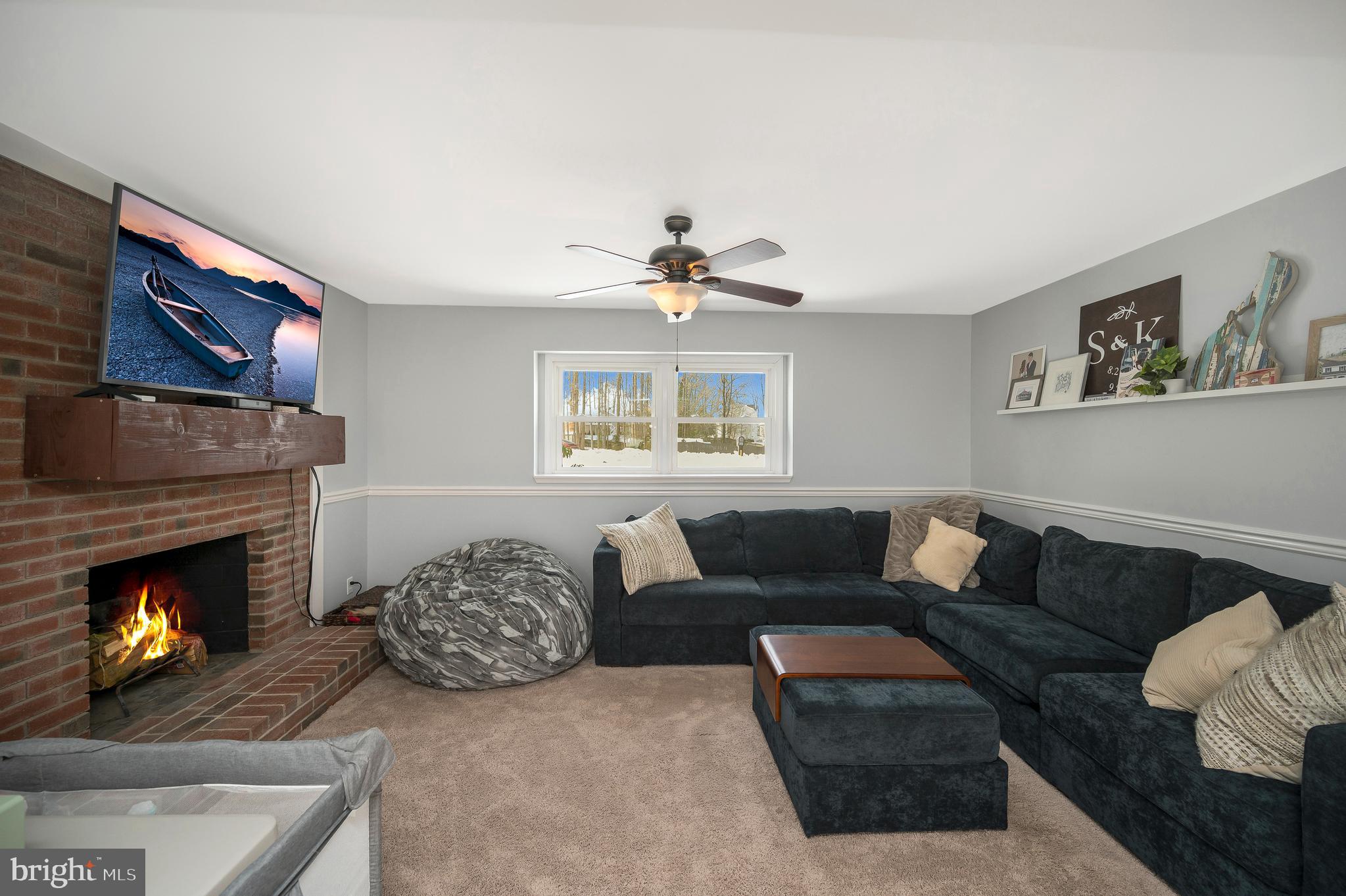 228 Choptank Road Stafford, VA 22556 - Photo 8 of 56 a living room with furniture and a fireplace