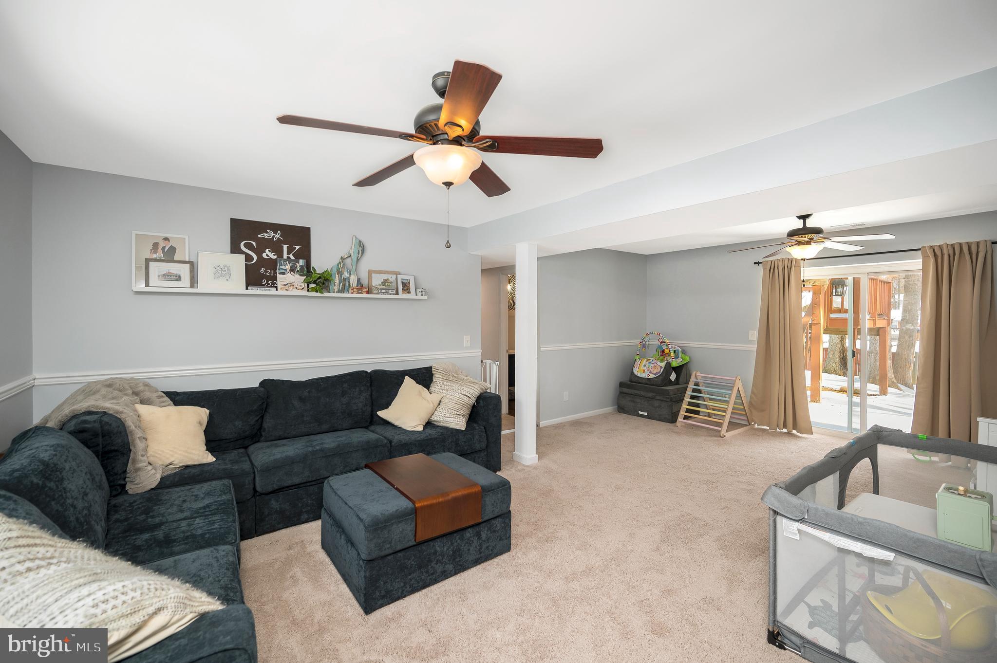 228 Choptank Road Stafford, VA 22556 - Photo 9 of 56 a living room with furniture and a large window