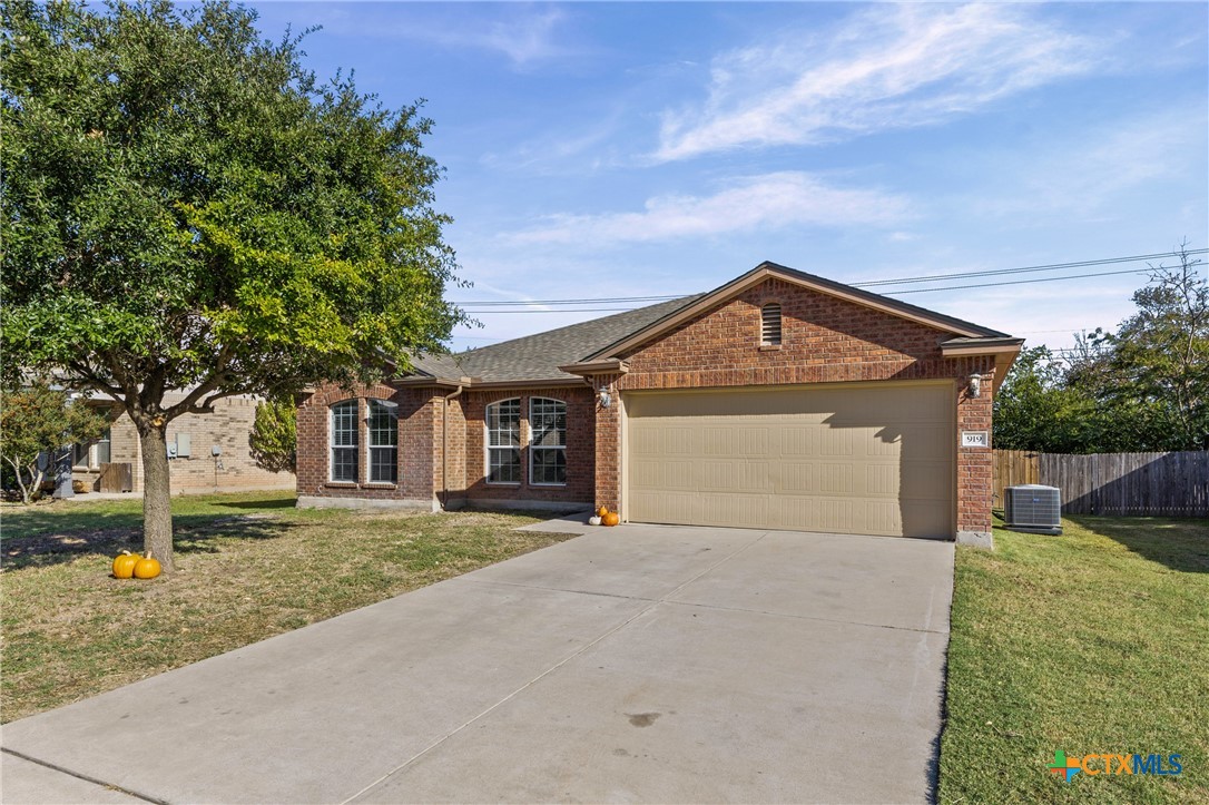 919 Starlight Drive Temple, TX 76502 - Photo 1 of 1 a front view of a house with a yard and garage