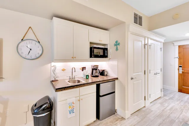 walk in closet with wooden floor