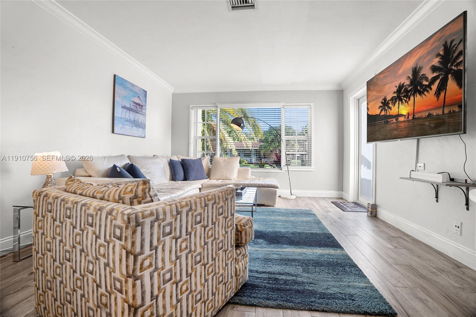 1611 Mayo Street Hollywood, FL 33020 - Photo 14 of 20 a bed sitting in a bedroom next to a window