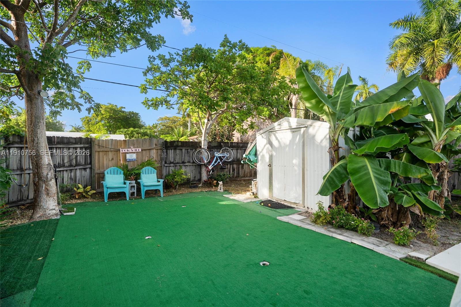 1611 Mayo Street Hollywood, FL 33020 - Photo 16 of 20 a view of yard with swimming pool and bench