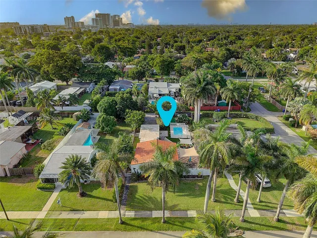 a view of multiple houses with a yard