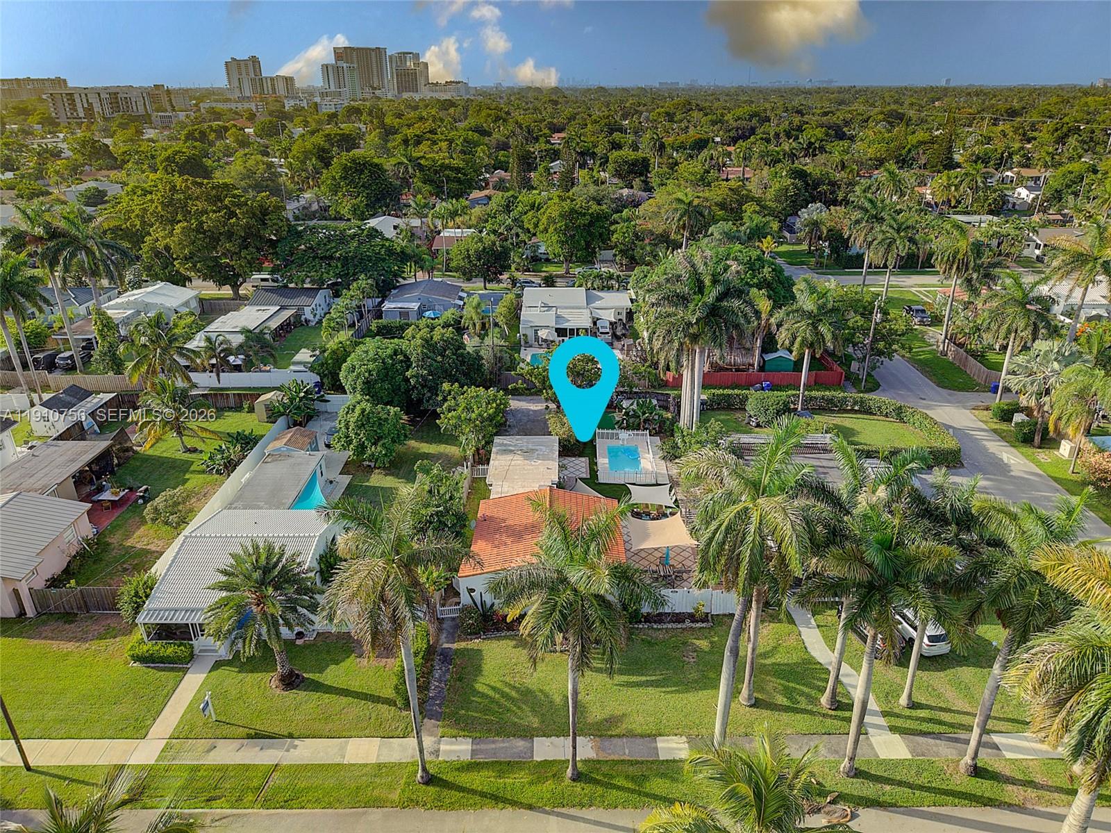 1611 Mayo Street Hollywood, FL 33020 - Photo 2 of 20 a view of multiple houses with a yard