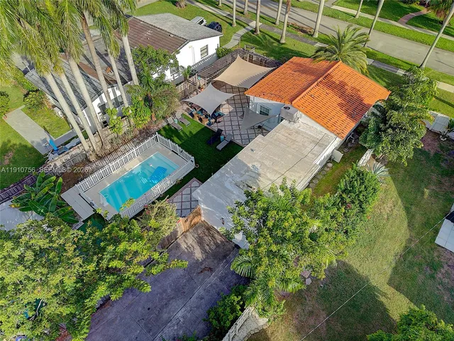 an aerial view of a house with a garden