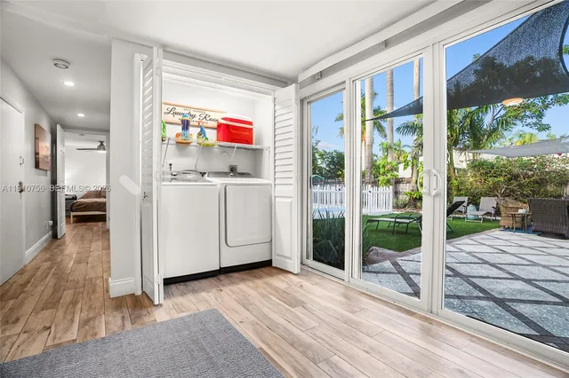 a view of a room with wooden floor and windows