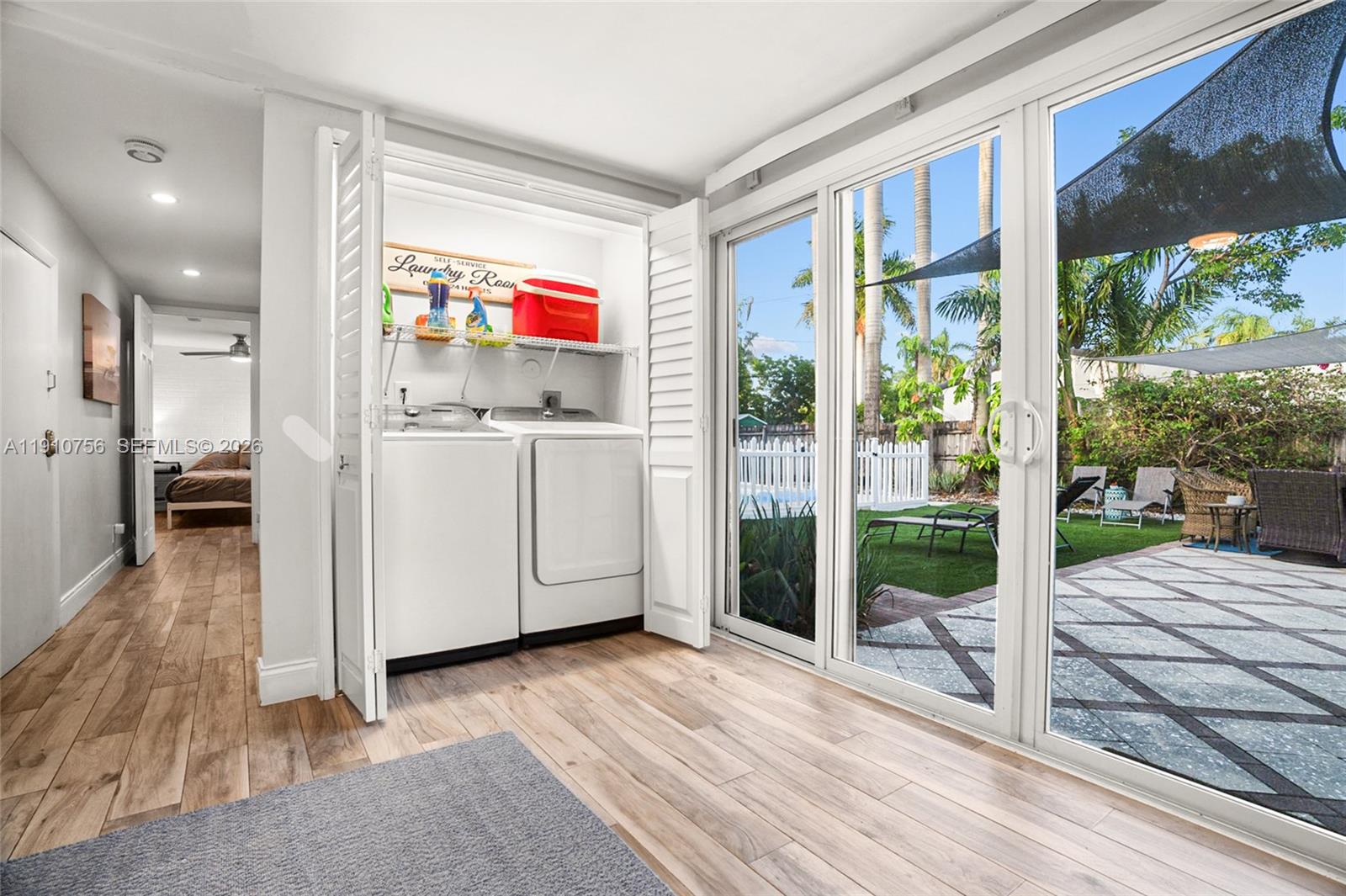 1611 Mayo Street Hollywood, FL 33020 - Photo 6 of 20 a view of a room with wooden floor and windows