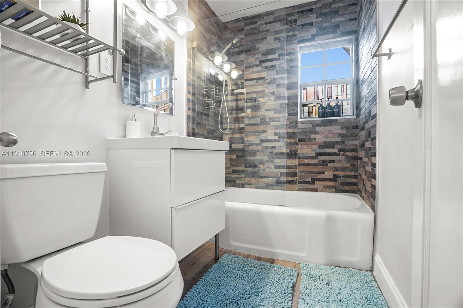 1611 Mayo Street Hollywood, FL 33020 - Photo 8 of 20 a bathroom with a toilet a sink and bathtub