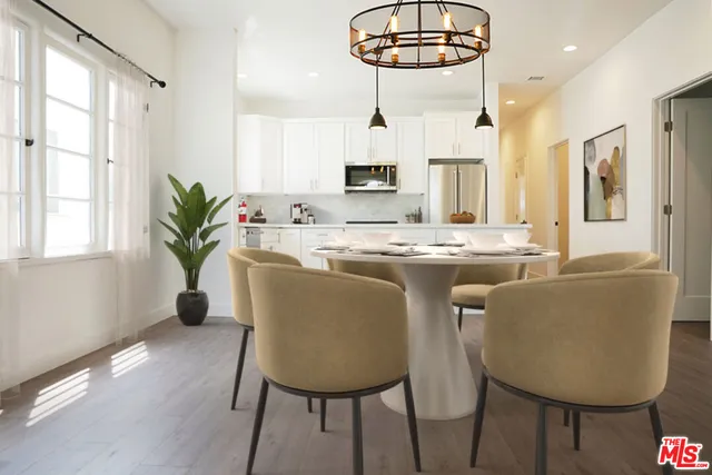 a dining room with furniture a livingroom and chandelier