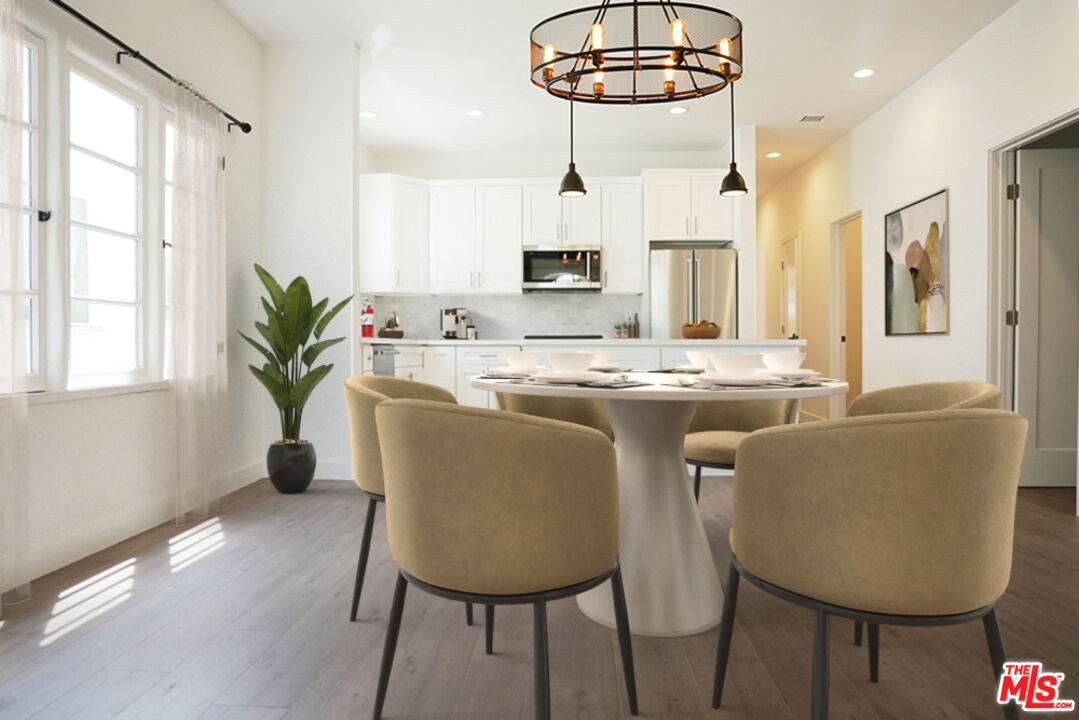 a dining room with furniture a livingroom and chandelier