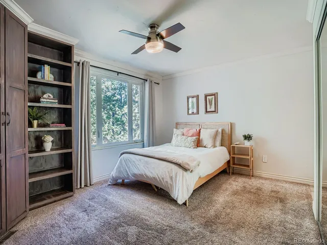 a spacious bedroom with a bed and a window