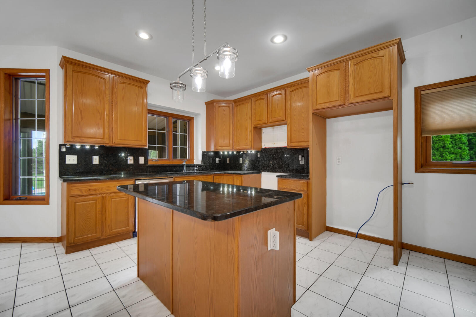 148 Timber Point Court Valparaiso, IN 46385 - Photo 13 of 30 a kitchen with stainless steel appliances granite countertop a refrigerator a sink a stove a microwave and island