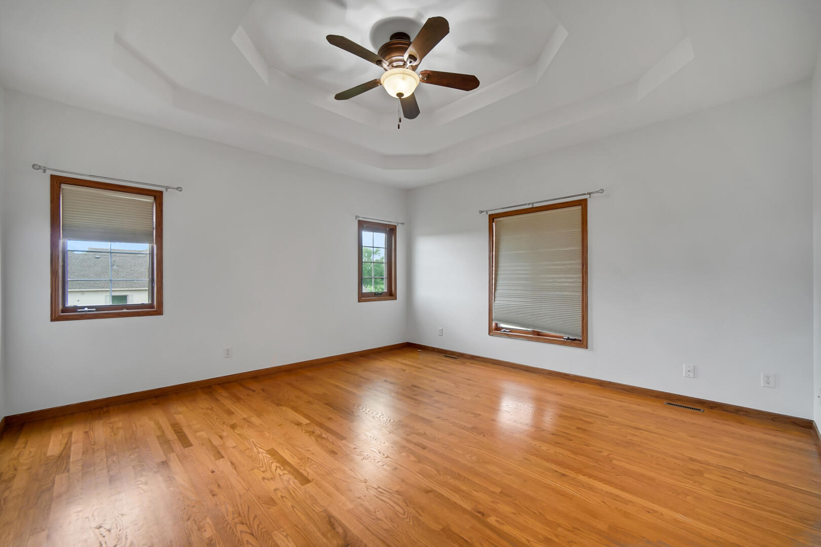 148 Timber Point Court Valparaiso, IN 46385 - Photo 16 of 30 a view of room with window ceiling fan and hardwood floor