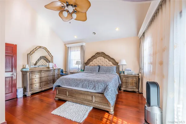 a bedroom with a bed dresser and a window
