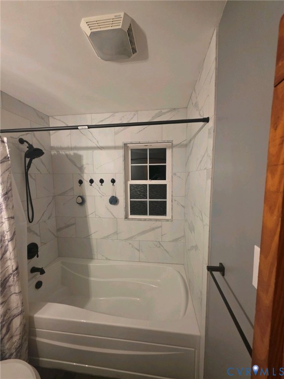 1081 Stones Road Walkerton, VA 23177 - Photo 11 of 23 Bathtub with white subway tile surround, black sho