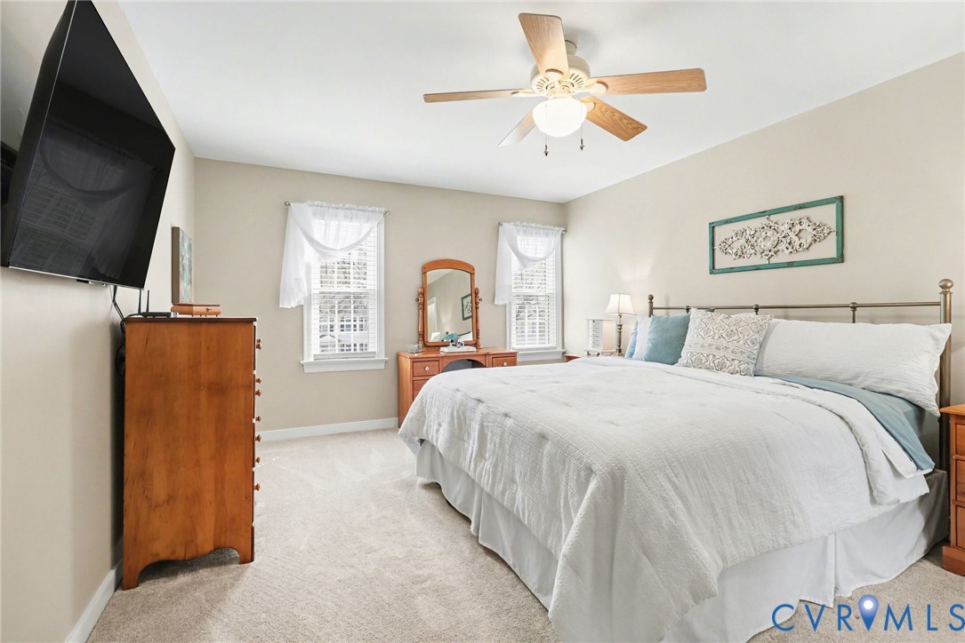 548 Glenmeadow Road Midlothian, VA 23114 - Photo 13 of 31 a bed room with a bed mirror and a flat tv screen